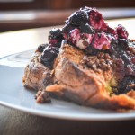 baked french toast with pecan crumble and blueberry syrup