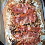 ricotta, prosciutto, and red onion pizza